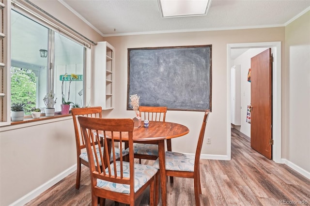 1213 S Taft Hill Rd, Fort Collins, CO 80521 - dining area with wood finished floors, crown molding, and a textured ceiling