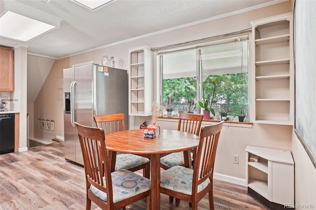 1213 S Taft Hill Rd, Fort Collins, CO 80521 - dining space with light wood-style floors, ornamental molding, and a textured ceiling