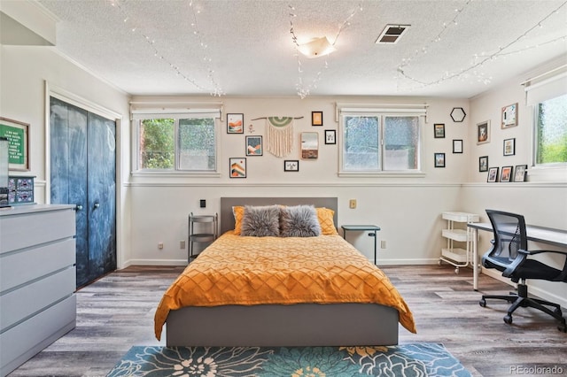1213 S Taft Hill Rd, Fort Collins, CO 80521 - bedroom with wood finished floors and a textured ceiling