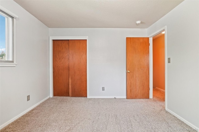 1213 S Taft Hill Rd, Fort Collins, CO 80521 - unfurnished bedroom featuring carpet flooring, a closet, and a textured ceiling
