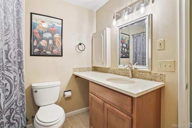 1213 S Taft Hill Rd, Fort Collins, CO 80521 - full bathroom with vanity, tasteful backsplash, and wood finished floors