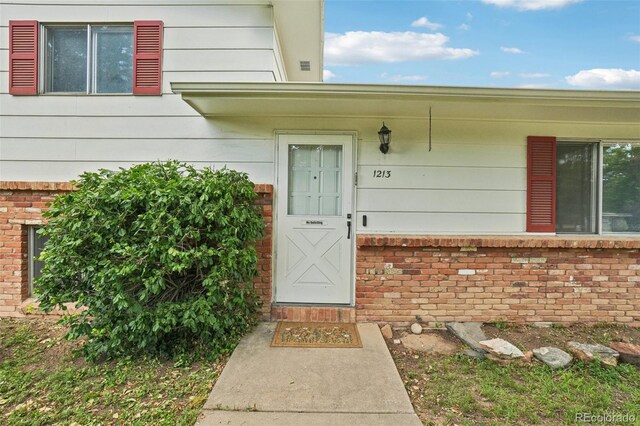 1213 S Taft Hill Rd, Fort Collins, CO 80521 - property entrance featuring brick siding