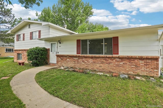 1213 S Taft Hill Rd, Fort Collins, CO 80521 - split level home featuring brick siding and a front yard