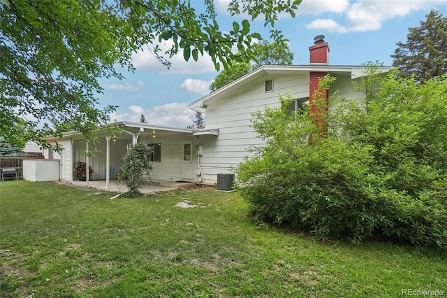 1213 S Taft Hill Rd, Fort Collins, CO 80521 - back of property with a patio area and a chimney