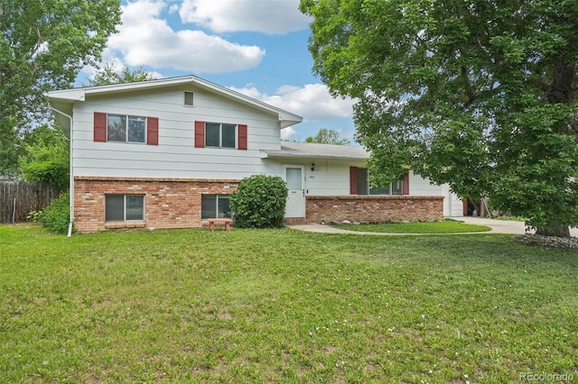 1213 S Taft Hill Rd, Fort Collins, CO 80521 - tri-level home featuring brick siding, a garage, and concrete driveway