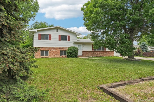 1213 S Taft Hill Rd, Fort Collins, CO 80521 - view of front of property featuring brick siding and a front yard