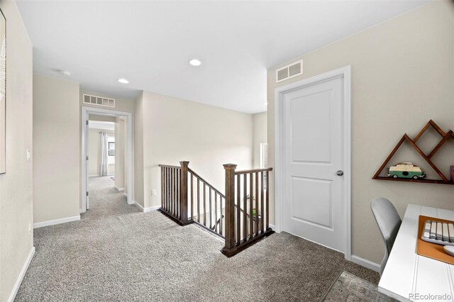 8261 Garden City Ave, Littleton, CO 80125 - hall with carpet flooring, an upstairs landing, baseboards, and recessed lighting