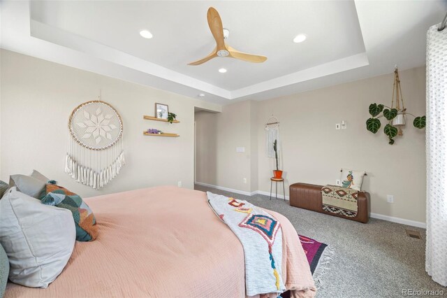 8261 Garden City Ave, Littleton, CO 80125 - carpeted bedroom with a raised ceiling, recessed lighting, baseboards, and ceiling fan