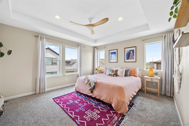 8261 Garden City Ave, Littleton, CO 80125 - carpeted bedroom featuring a tray ceiling, recessed lighting, baseboards, and ceiling fan