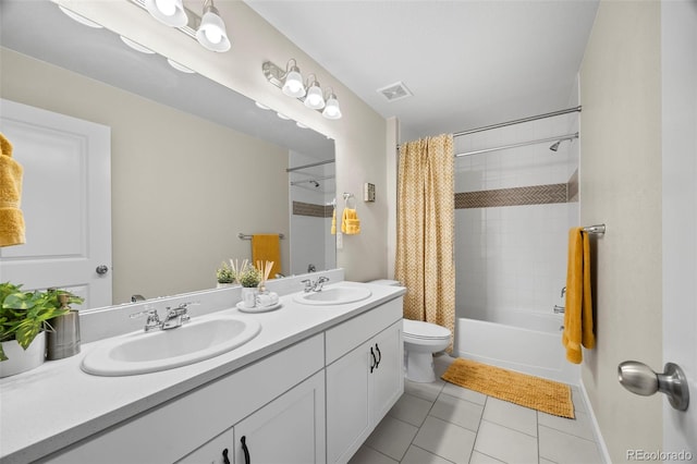 8261 Garden City Ave, Littleton, CO 80125 - full bath featuring toilet, double vanity, shower / bathtub combination with curtain, and tile patterned floors