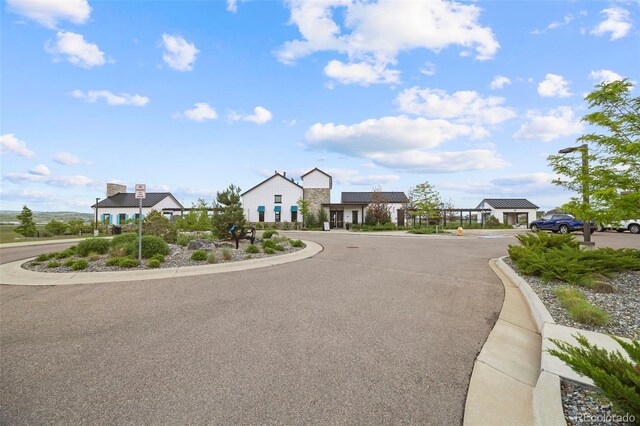 8261 Garden City Ave, Littleton, CO 80125 - view of asphalt street featuring curbs