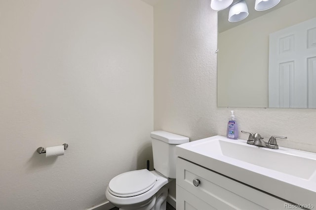 5712 S Lowell Blvd, Littleton, CO 80123 - half bath featuring vanity and toilet