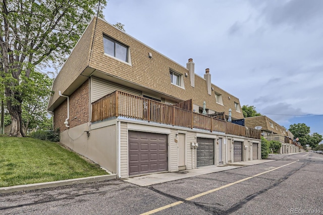 5712 S Lowell Blvd, Littleton, CO 80123 - back of property with a yard, a chimney, and a balcony