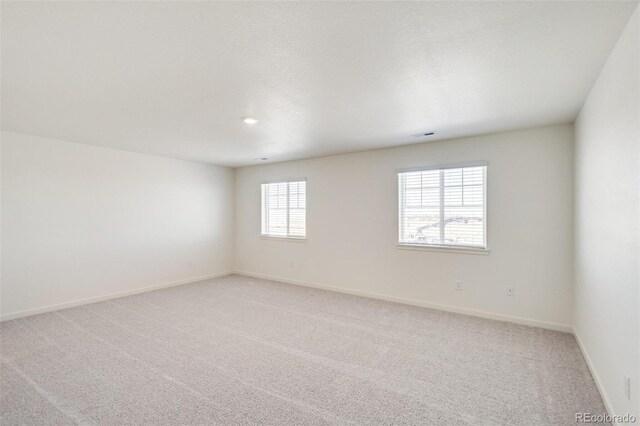 11790 Foraker Ln, Colorado Springs, CO 80925 - unfurnished room featuring light colored carpet and baseboards