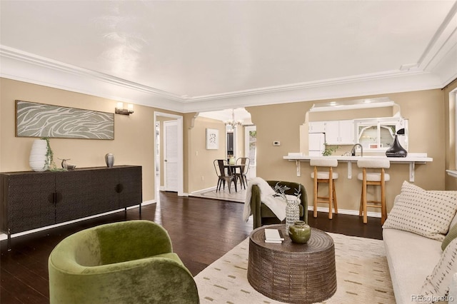 3979 S Grant St, Englewood, CO 80113 - living room featuring a chandelier, crown molding, and hardwood / wood-style floors