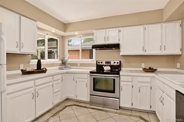 3979 S Grant St, Englewood, CO 80113 - kitchen featuring stainless steel appliances, under cabinet range hood, light tile patterned floors, and white cabinets