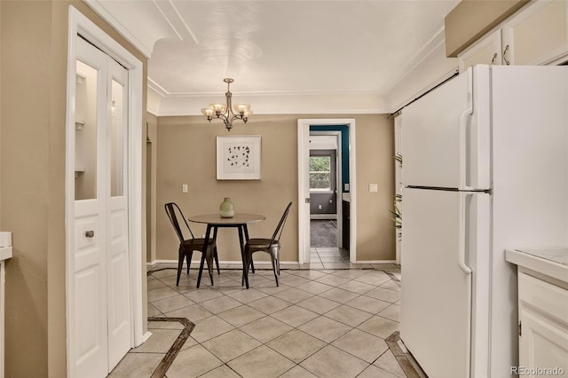 3979 S Grant St, Englewood, CO 80113 - dining room featuring a chandelier, light tile patterned floors, and ornamental molding