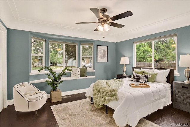 3979 S Grant St, Englewood, CO 80113 - bedroom with multiple windows, wood finished floors, a ceiling fan, and ornamental molding