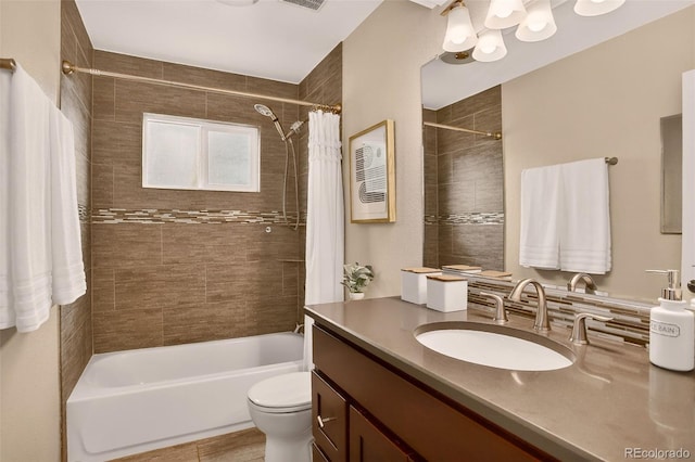 3979 S Grant St, Englewood, CO 80113 - bathroom featuring vanity, shower / tub combo with curtain, and a chandelier