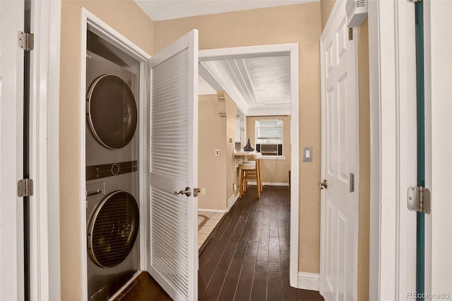 3979 S Grant St, Englewood, CO 80113 - laundry area featuring stacked washer and clothes dryer, dark wood-style flooring, and cooling unit