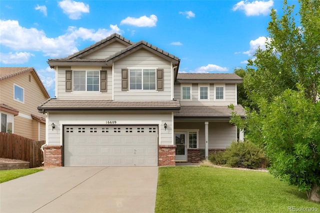 view of front of home featuring a garage and a front lawn