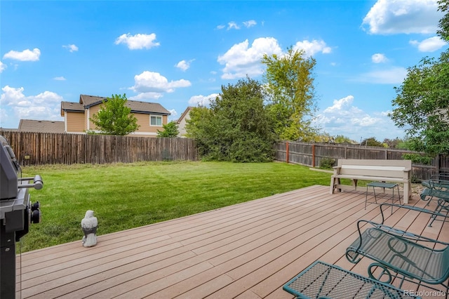 wooden deck with a lawn