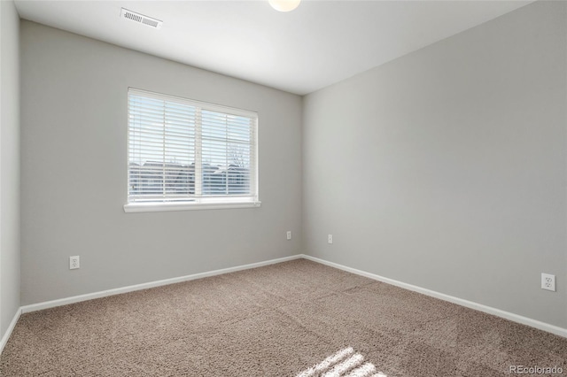 spare room featuring carpet