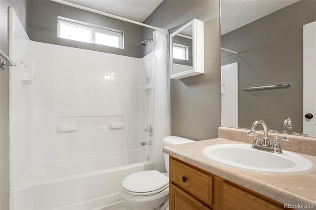 full bathroom featuring shower / bathtub combination with curtain, vanity, and toilet