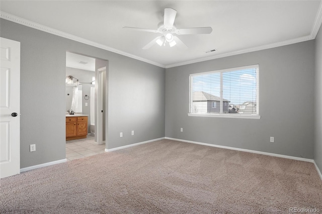 unfurnished bedroom featuring connected bathroom, ceiling fan, crown molding, and light colored carpet