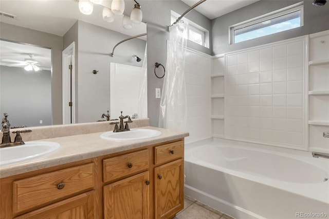 bathroom featuring tile patterned flooring, ceiling fan, shower / bathtub combination with curtain, and vanity