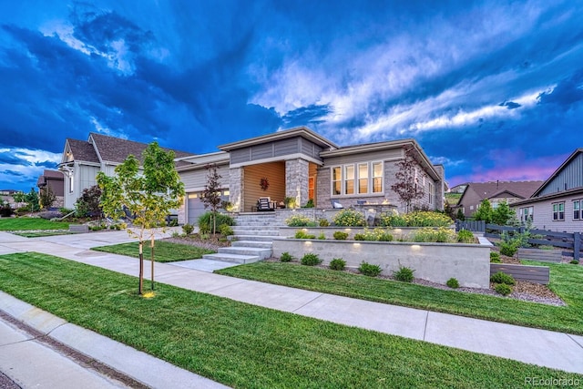 2159 Bellcove Dr, Castle Pines, CO 80108 - view of front facade featuring stone siding, a garage, driveway, and a front yard