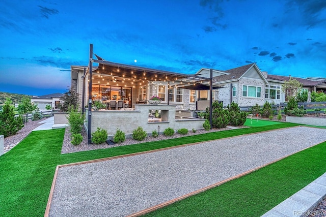 2159 Bellcove Dr, Castle Pines, CO 80108 - view of front of house with a putting green and a lawn