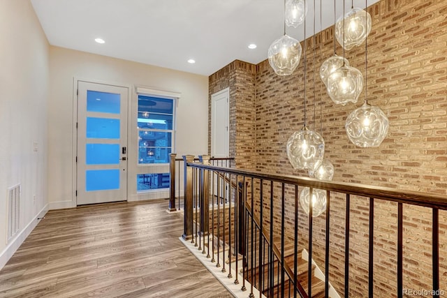 2159 Bellcove Dr, Castle Pines, CO 80108 - hall with wood finished floors, an upstairs landing, and recessed lighting