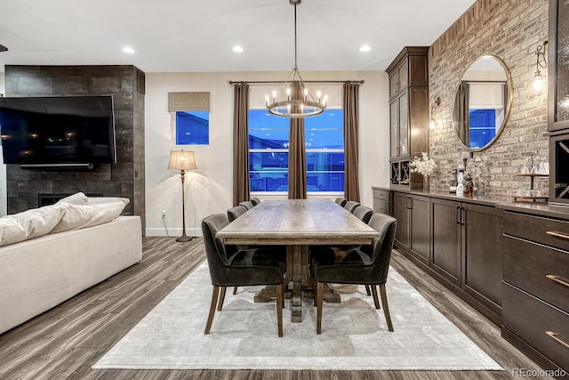 2159 Bellcove Dr, Castle Pines, CO 80108 - dining area with a chandelier, wood finished floors, and recessed lighting