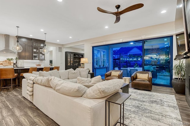 2159 Bellcove Dr, Castle Pines, CO 80108 - living area with wood finished floors, a ceiling fan, recessed lighting, and bar