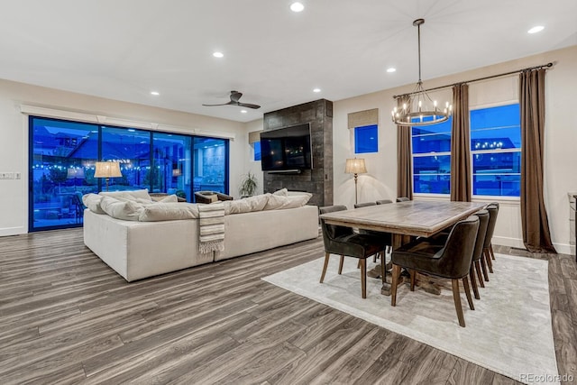 2159 Bellcove Dr, Castle Pines, CO 80108 - dining area featuring wood finished floors, recessed lighting, a chandelier, and a ceiling fan