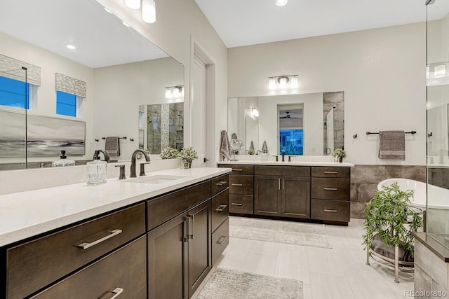 2159 Bellcove Dr, Castle Pines, CO 80108 - full bathroom featuring a tile shower, two vanities, and tile patterned flooring