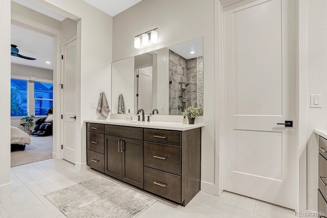 2159 Bellcove Dr, Castle Pines, CO 80108 - bathroom with vanity, tiled shower, connected bathroom, and tile patterned floors