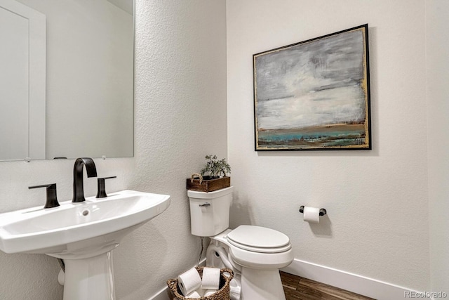 2159 Bellcove Dr, Castle Pines, CO 80108 - bathroom with toilet and wood finished floors