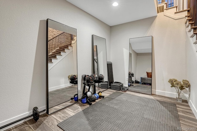 2159 Bellcove Dr, Castle Pines, CO 80108 - exercise room with wood finished floors and baseboards
