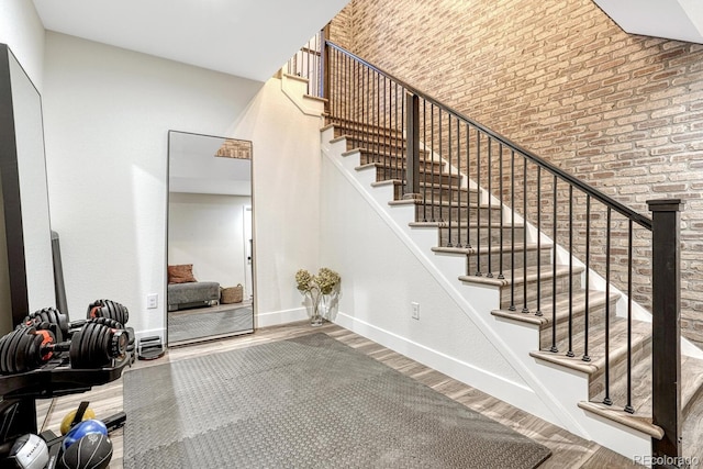 2159 Bellcove Dr, Castle Pines, CO 80108 - stairway featuring wood finished floors and a towering ceiling
