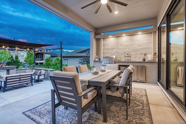 2159 Bellcove Dr, Castle Pines, CO 80108 - view of patio with an outdoor living space, an outdoor kitchen, a ceiling fan, and outdoor dining space