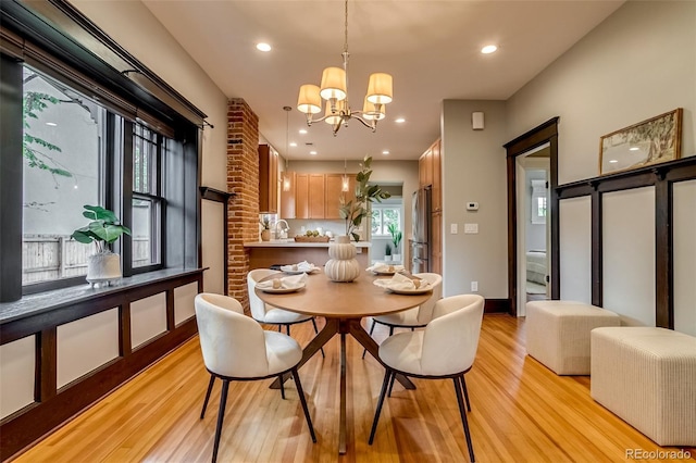 3525 N Alcott St, Denver, CO 80211 - dining area featuring light wood-style flooring, a chandelier, and recessed lighting