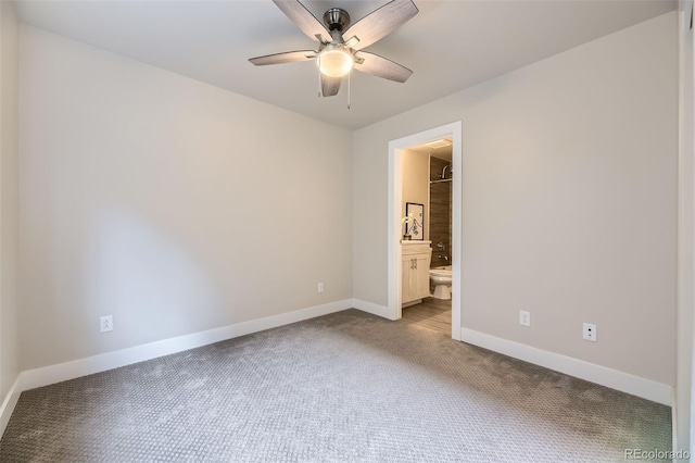 spare room featuring ceiling fan and carpet flooring