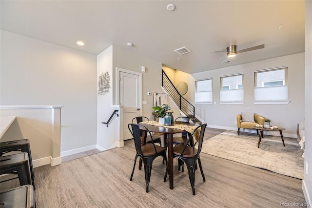 dining room featuring ceiling fan and light wood-type flooring