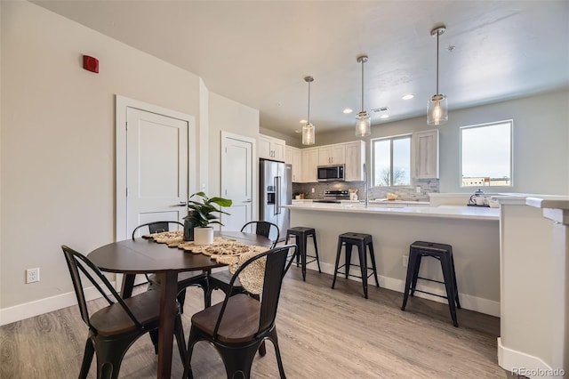 dining area featuring light hardwood / wood-style flooring