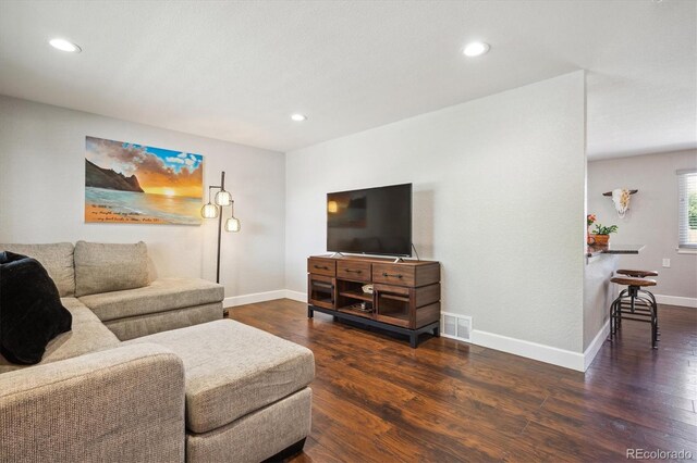 3145 W Farmdale Rd, Englewood, CO 80110 - living area featuring baseboards, wood finished floors, and recessed lighting