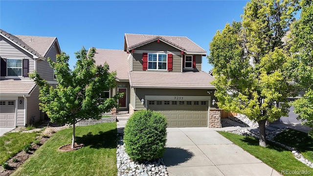 9255 Melborne Ct, Parker, CO 80134 - traditional home featuring an attached garage, driveway, a tiled roof, and a front yard