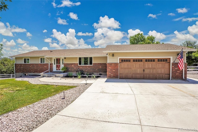 9880 E 157th Ave, Brighton, CO 80602 - ranch-style home featuring brick siding, an attached garage, and driveway