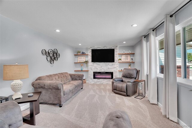 9880 E 157th Ave, Brighton, CO 80602 - living area featuring carpet floors, a fireplace, recessed lighting, and baseboards